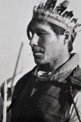 Young man wearing a feathered head dress