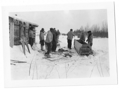 Hunters or trappers at a cabin