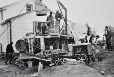 Cree men working around a construction site