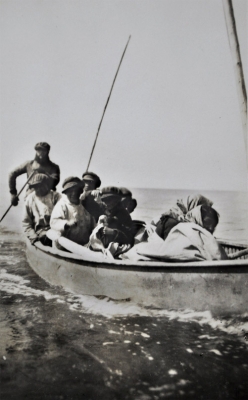Cree family traveling by canoe
