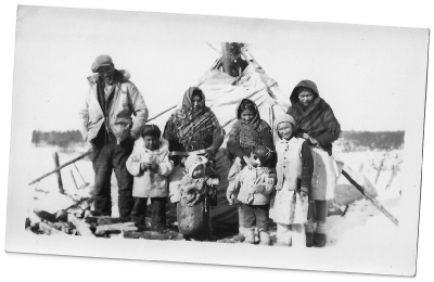 Cree family at their winter teepee camp