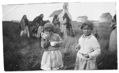 Cree girls eating bannock and drinking tea