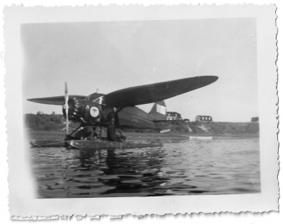 Pilot or missionary in front of a float plane