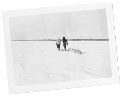 Hunters on snowshoes pulling a toboggan