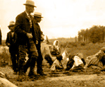 Mushkegowuk People at English River receiving candies, 1905