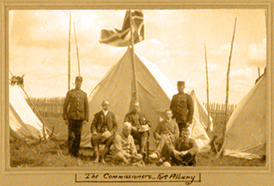 The James Bay Treaty signing party at Fort Albany. Standing: Joseph L. Vanasse (L), James Parkinson (R) of NWMP. Seated: Commissioners Samuel Stewart (L), Daniel McMartin, Duncan Campbell Scott (R) Foreground: HBC Chief Trader Thomas. 1905